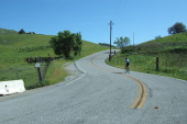 Another cyclist approaches the summit of Old Calaveras Rd.