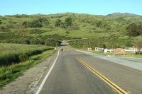 Crossing Halls Valley and passing the entrance to Grant Ranch County Park