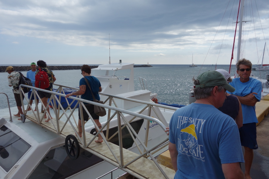 Tourists board the catamaran.