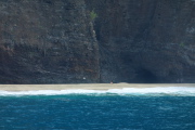 Two hikers enjoy the the southern end of Kalalau Beach in solitude.