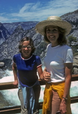 Kay clutches Laura's hand fimly while they pose for a photo on the bridge above the brink of Nevada Fall.