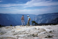 Bill and David emerge onto the shoulder of North Dome and enjoy a hazy view of Yosemite Valley.