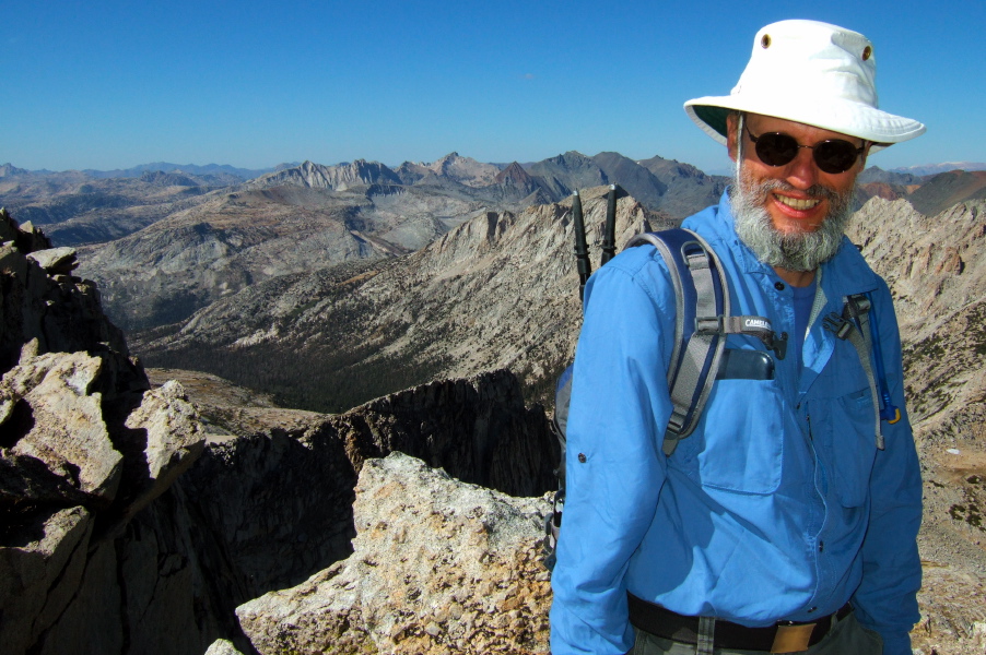 Frank arrives at the summit of North Peak.