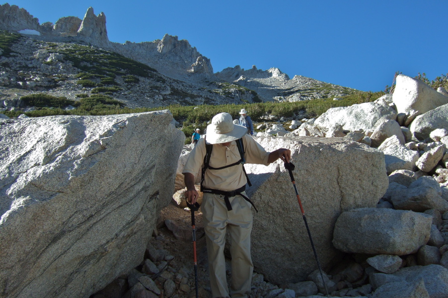 David passes through the cracked rock.  Frank and Stella follow shortly.