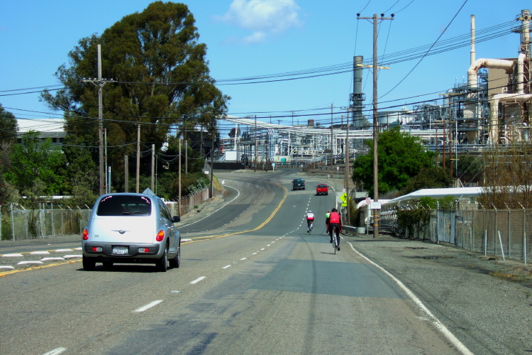 Riding past the refineries.