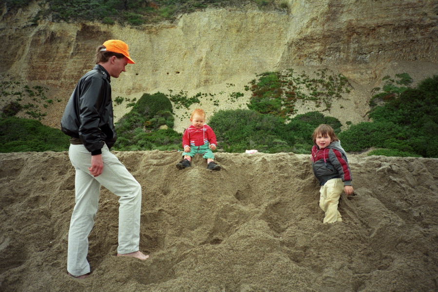 Playing on a sand hill.