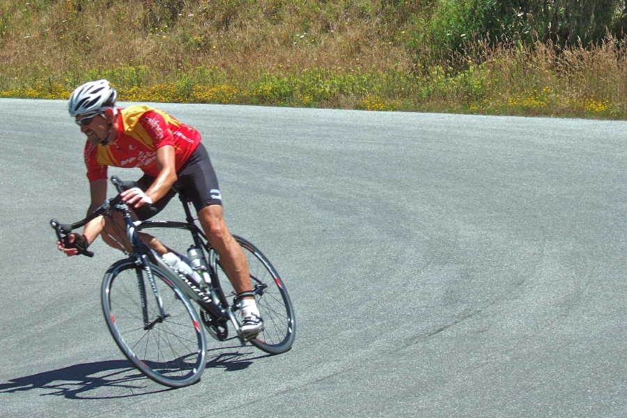 Bernard Bell slices through the hairpin corner, touching the rear brake lightly.