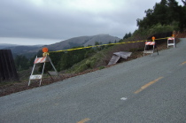 A fence is down along Alpine Road.
