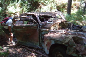 Ron investigates an old wrecked Oldsmobile.