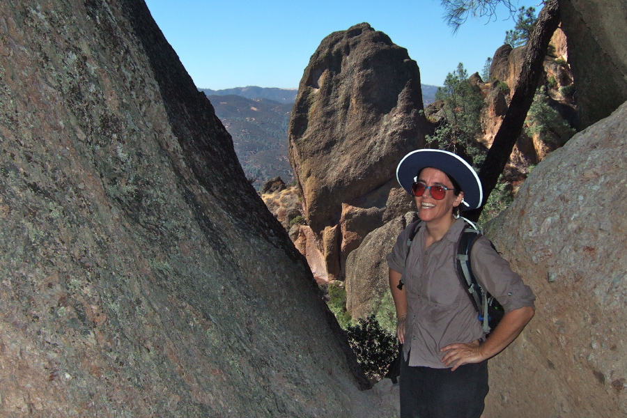 Stella gets ready to climb the rock face.