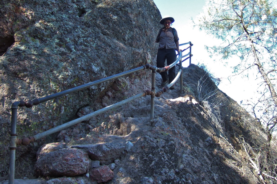 Stella descends the last stairway with railing.