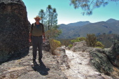 Ron stands next to a pinnacle on the Condor Gulch Trail.