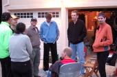 Tim Woudenberg (yellow hat) tells more tall tales before dinner.