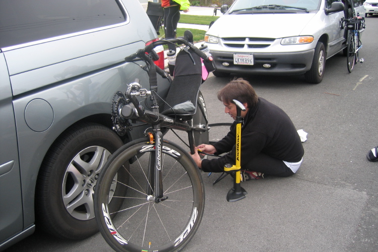 Dana Lieberman tops off tire pressure.