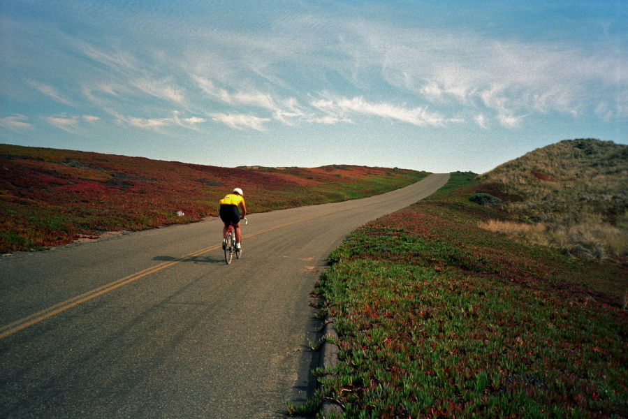 Richard climbs the road from North Beach.