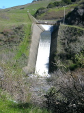 Water flowing over the spillway at Nicasio Reservoir.