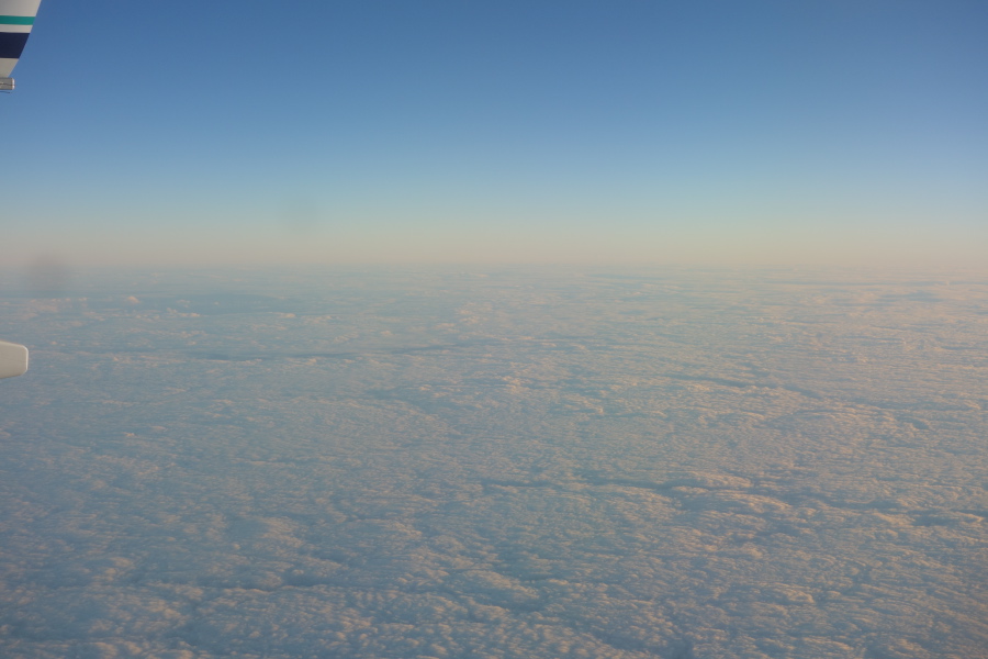Somewhere out over the ocean the clouds turn from puffy, cotton-balls into a low sheet of fog.
