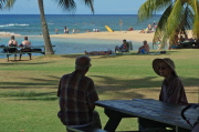 David and Kay rest on a bench at Po'ipu Beach Park.