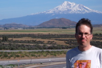 Bill in front of Mt. Shasta (14162ft) from southbound I-5 near Yreka, CA.