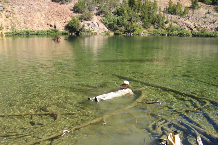 David takes a dip, fully clothed, into Heart Lake.