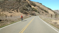 More cyclists climb through Rabbit Valley.