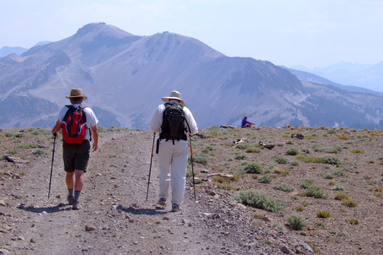 Ron and David walk down the 4WD road while Alice waits.