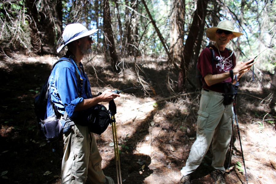 Frank and Bill do a quick radio check before Frank heads off to Summit Rock.