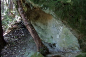 Hollowed underside of a large sandstone boulder