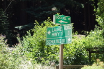Highway signs in the community of Laurel