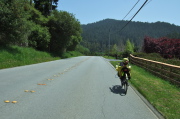 Zach rides Pescadero Road toward Pescadero.