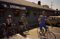 Stella, Pete, and Ron leave the Saturn Cafe after lunch.