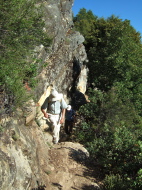 The trail passes beneath some cliffs.