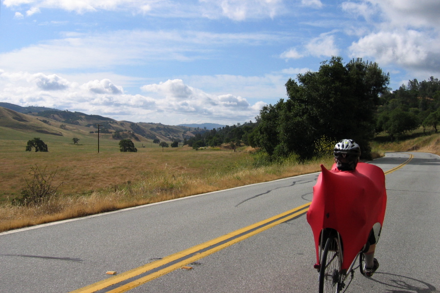Ron Bobb rides south on CA25 through Bear Valley under an interesting sky. (1450ft)