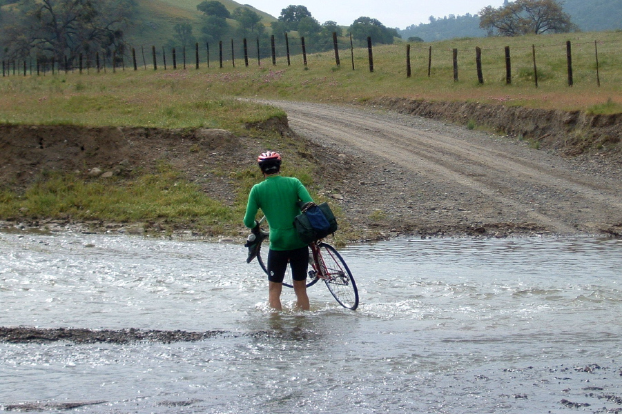 John Woodfill fords the San Benito River at during high water season.