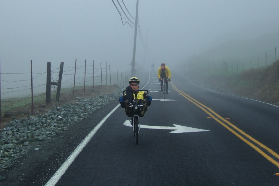 Zach climbs through the cold fog to the top of Pig Farm Hill.