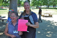 Vickie Romo and Karin Nelson receive their well-deserved Thank You card for organizing the Worker's Picnic.
