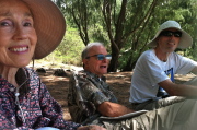 Kay, David, and Bill relax under the ironwoods at Shipwreck Beach.