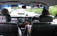 View out the front of the taxi along the ECP