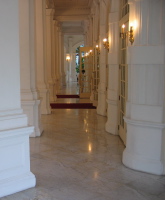 Polished marble floor and whitewashed walls of the Raffles Hotel