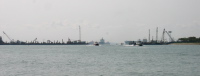 Container ships waiting to dock at Singapore