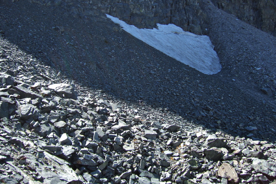 Frank presses on up through the loose talus.