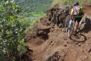 Somehow this mountain biker got down this rocky washout.
