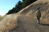 David hikes up a short hill on the Long Ridge Trail.