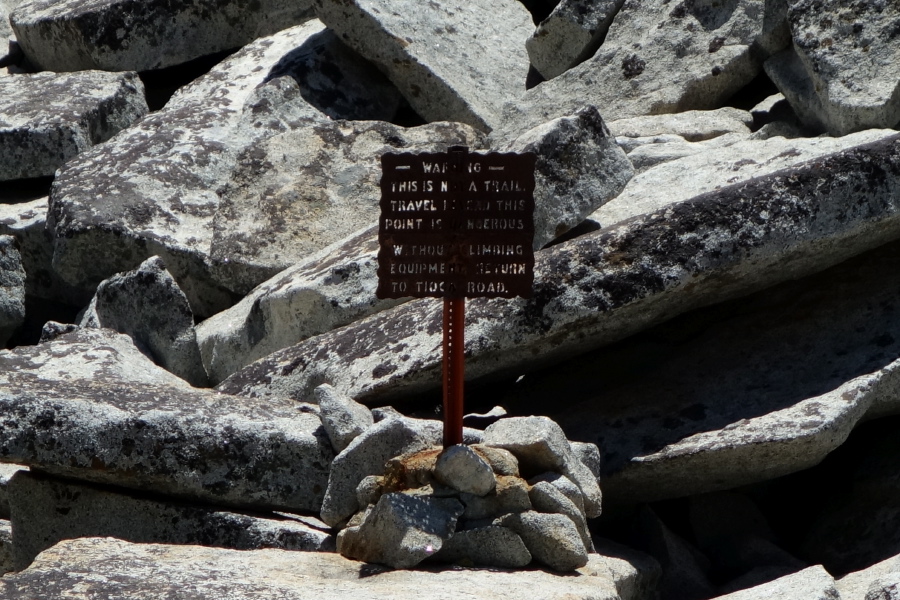 Warning sign near the top of the cascade for those who dare to venture beyond.