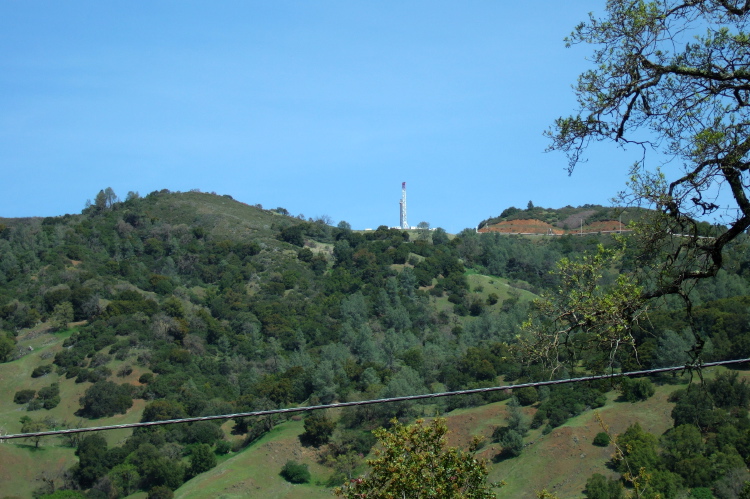 Geothermal well on the opposite ridge (2800ft) being drilled.