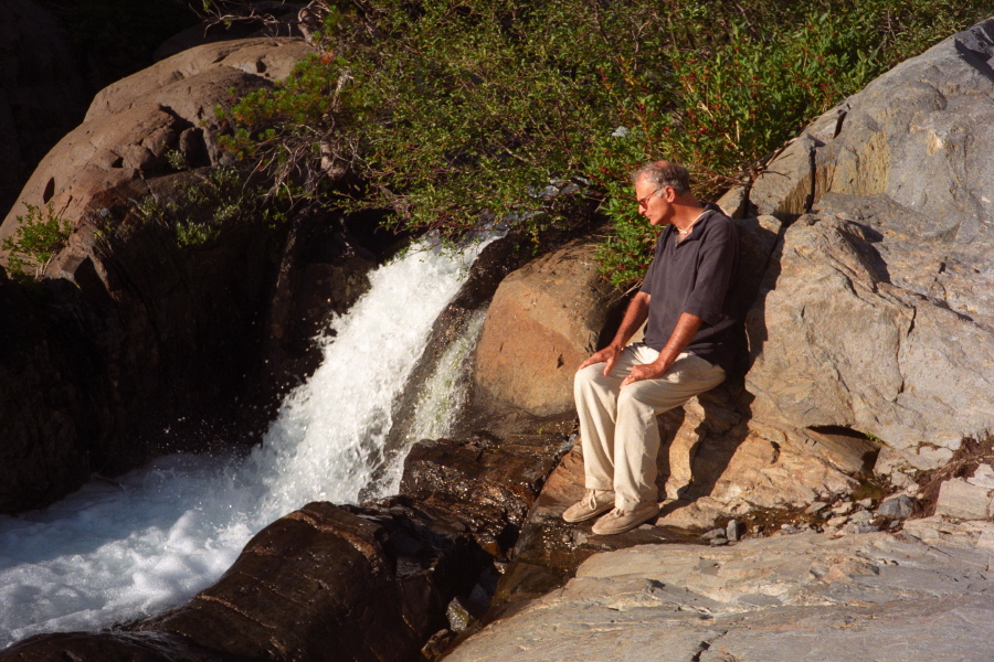 David sits next to Shadow Creek.