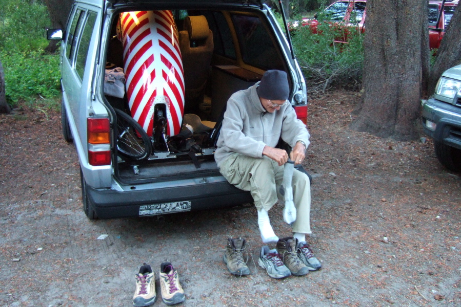 David puts on his wool socks and hiking shoes.