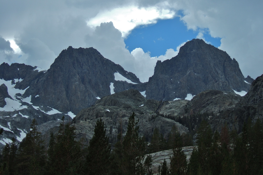 Clouds swirl threateningly about Ritter and Banner.