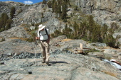 David starts off across the slabs on the south side of Garnet Lake.