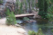 The John Muir Trail continues across the substantial bridge over the inlet to Shadow Lake.